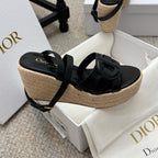 Black platform espadrille sandals with front crossover strap and braided wedge