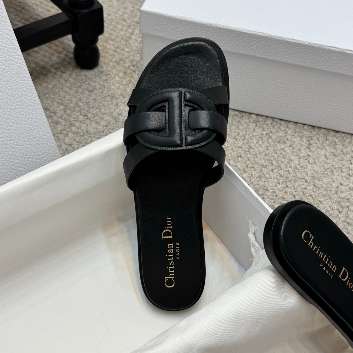Dior black slide sandal with wide double straps and gold Christian Dior logo on footbed