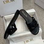 Dior black slide sandal with thick wide straps and textured strap details