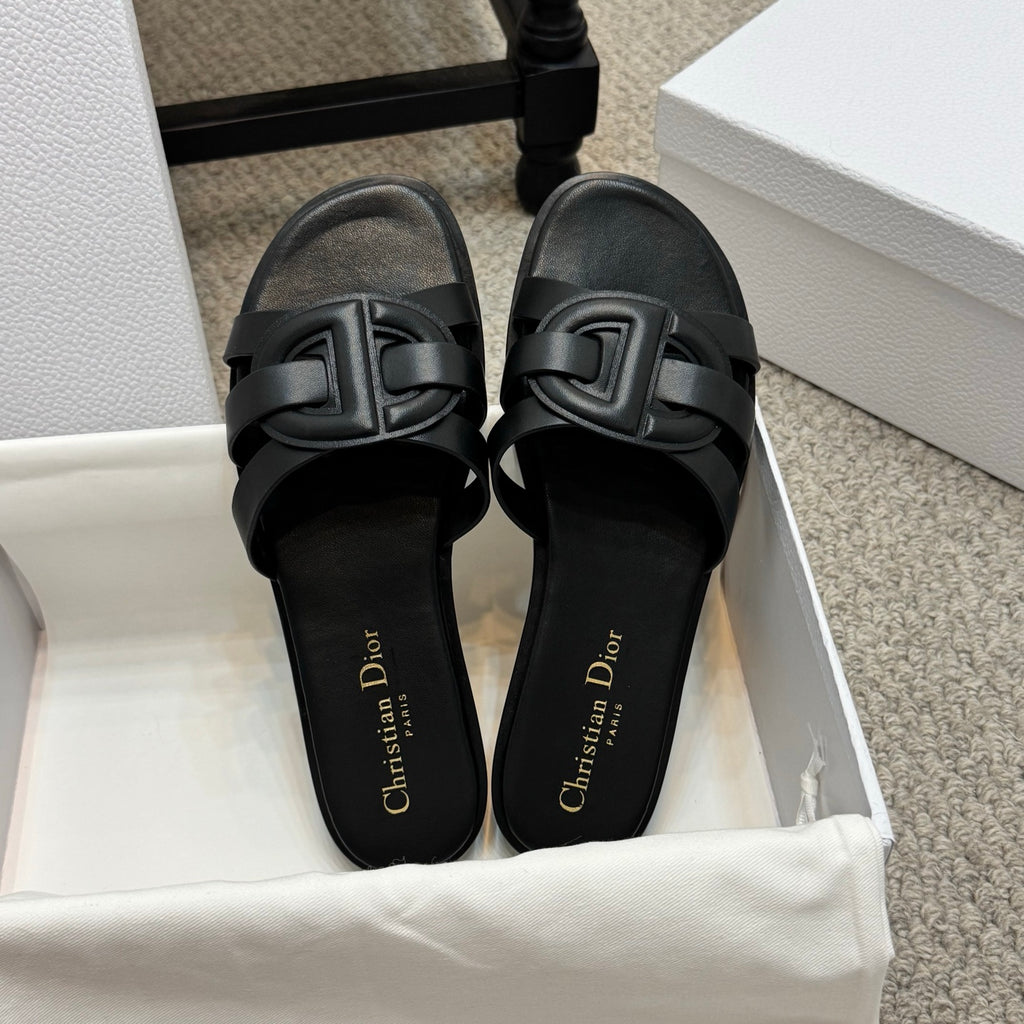 Dior black slide sandals with bold double-buckle straps and gold Christian Dior lettering