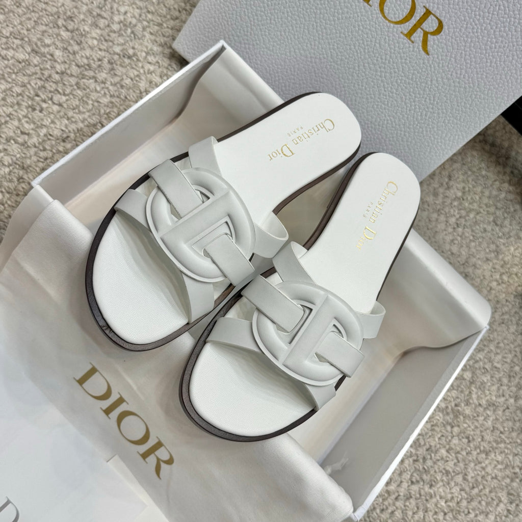 Pair of white Dior slide sandals with knotted-style front strap detail