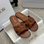 Brown leather Dior slide sandals with open toe and double strap detail