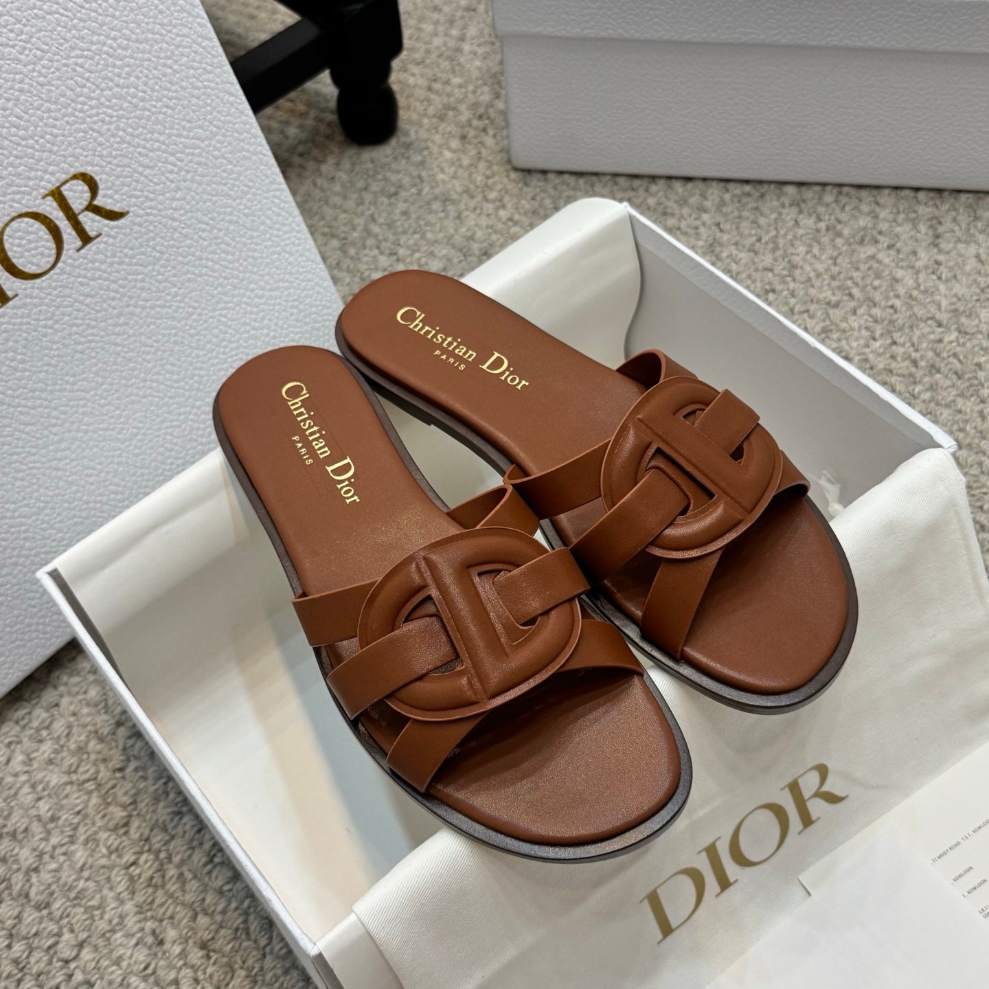 Brown leather Dior slide sandals with open toe and double strap detail