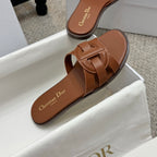 Brown leather Dior slide sandal, close-up of footbed and knotted strap detail