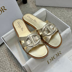 Dior metallic gold slide sandals with interlocking logo-style buckle straps