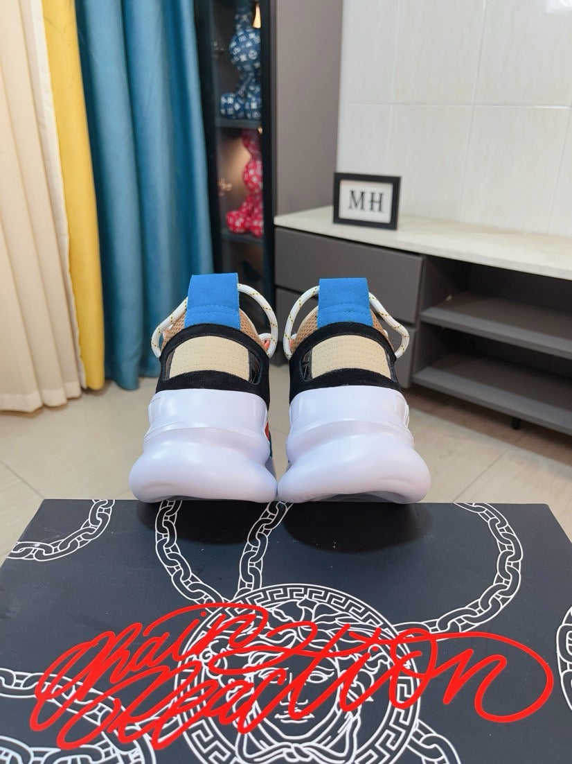Pair of sneakers from the back view: white uppers, blue collar tabs, thick white soles