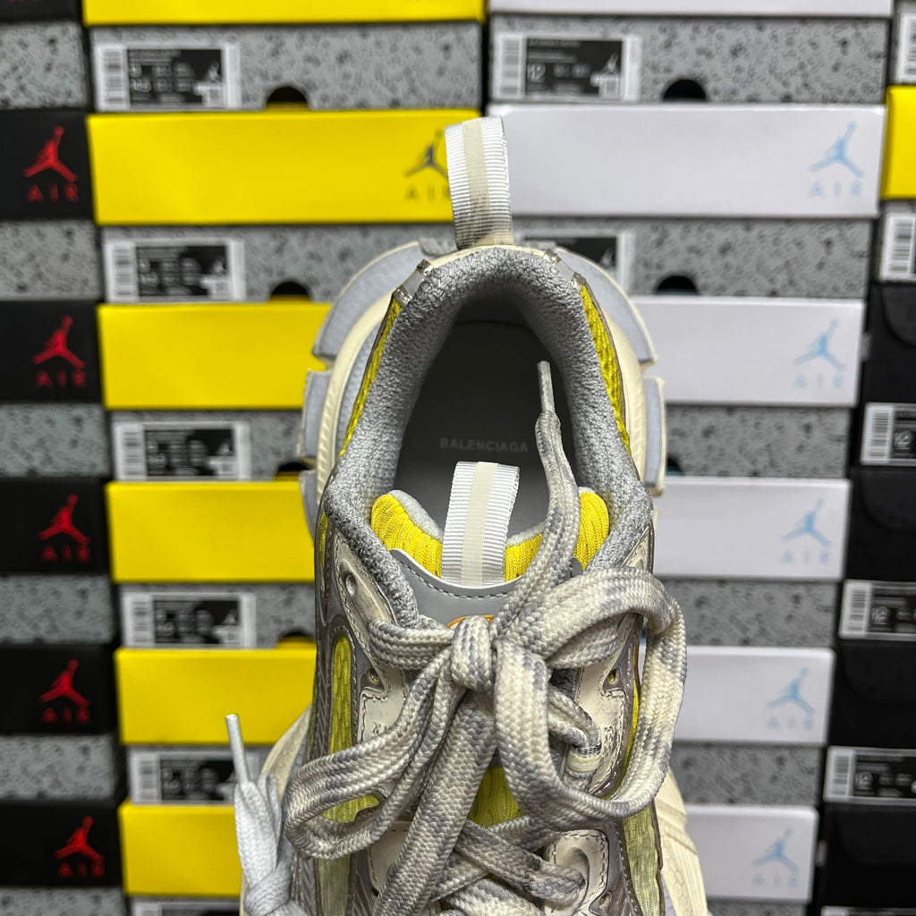 Balenciaga unisex sneakers, rear view with gray heel collar and bright yellow interior
