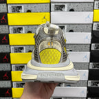 Balenciaga unisex sneakers rear view, yellow underlay with “BALENCIAGA” on sole