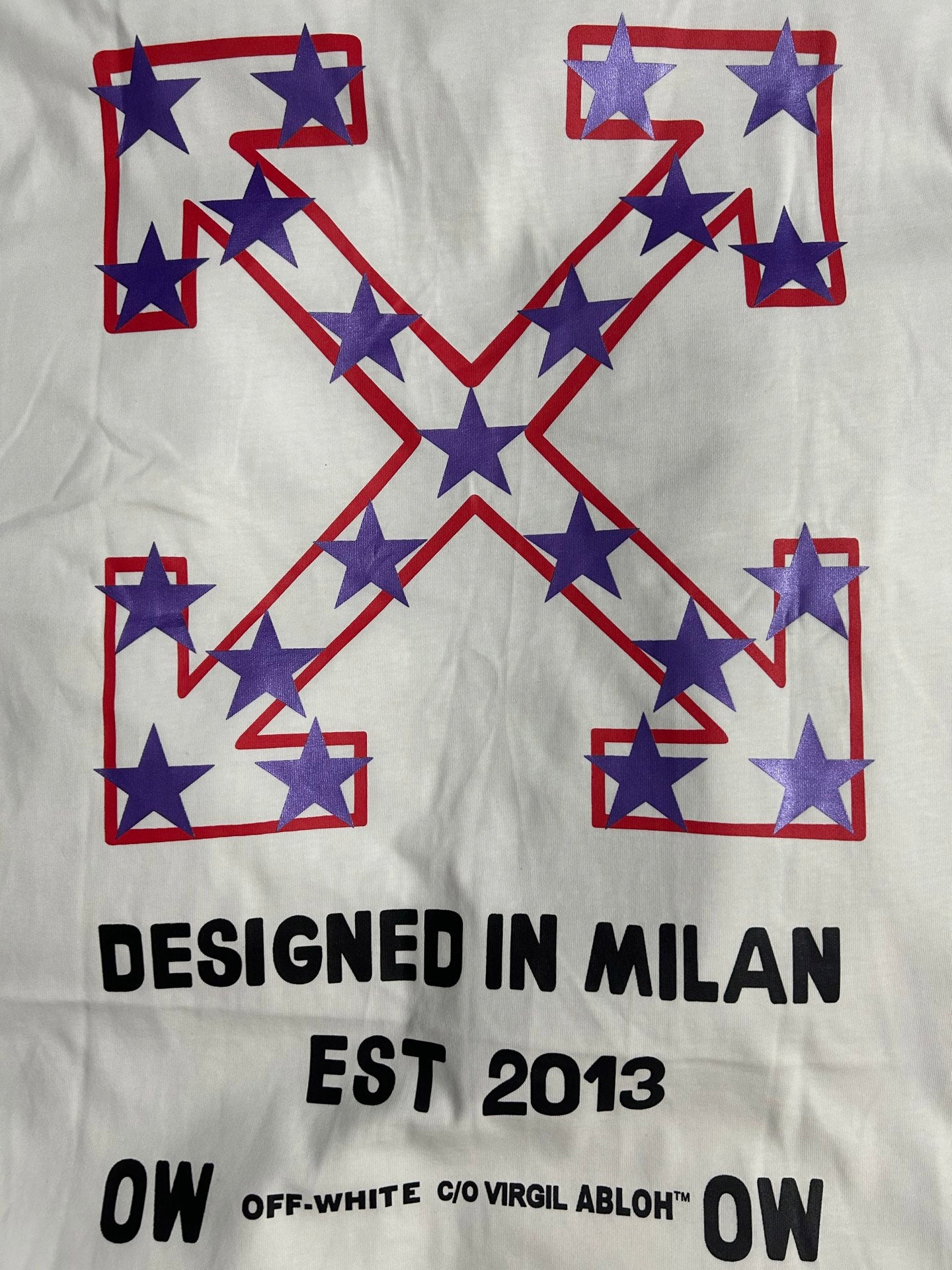 Off-White white T-shirt with star X graphic and "DESIGNED IN MILAN EST 2013"