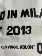 Off-White white T-shirt text detail: "DESIGNED IN MILAN EST 2013"