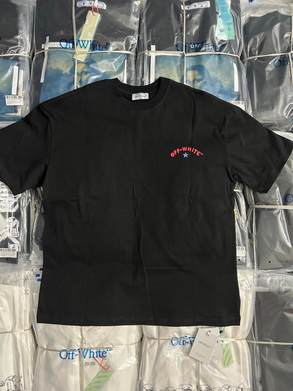 Black crewneck T-shirt with small red Off-White star logo on chest