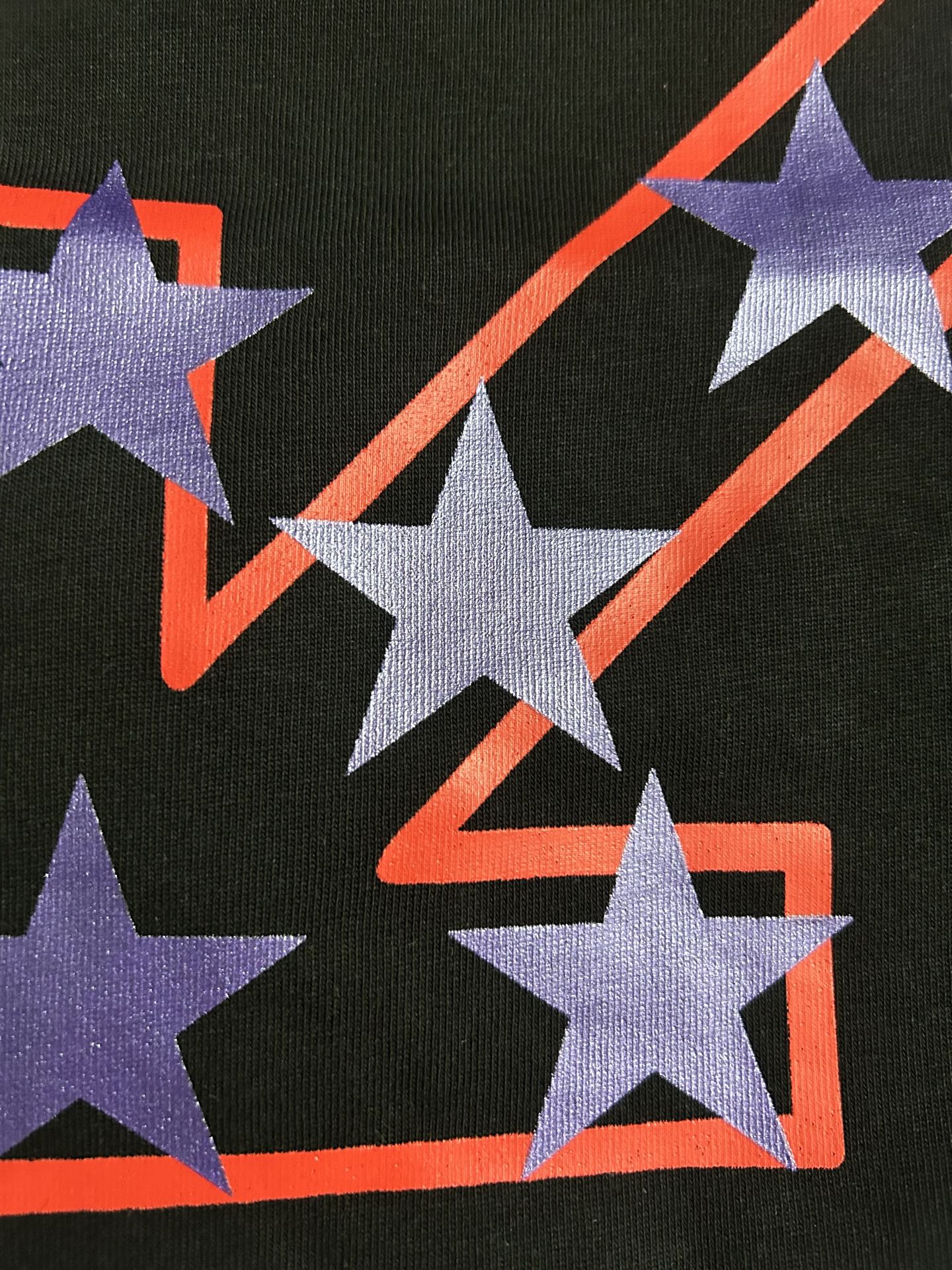 Black Off-White T-shirt close-up of purple stars and red outline on front