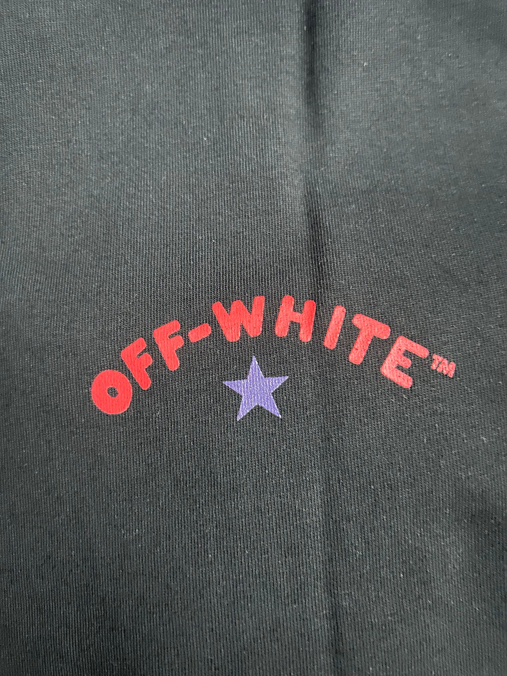Black Off-White T-shirt with red 'OFF-WHITE' lettering and purple star