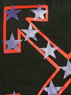 Black T-shirt graphic close-up with purple stars connected by red lines