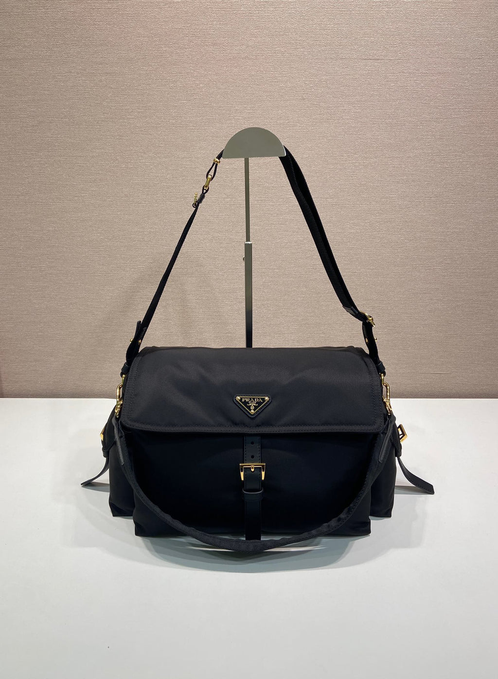 Prada nylon shoulder bag in dark navy with flap and gold-tone hardware