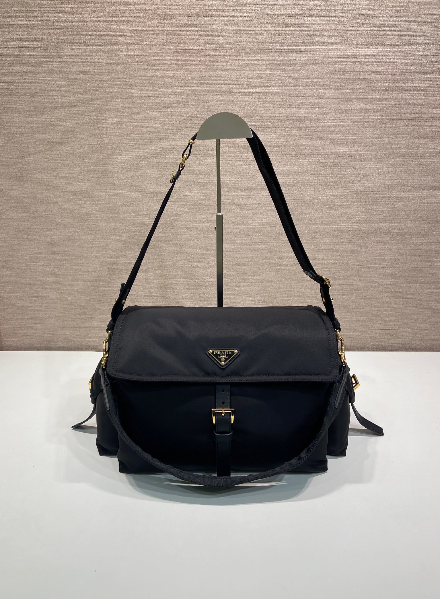 Prada nylon shoulder bag in dark navy with flap and gold-tone hardware