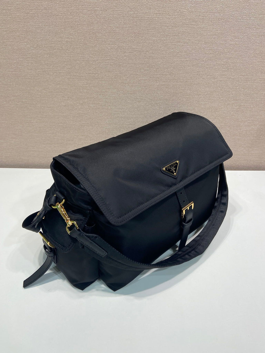 Prada nylon messenger bag with flap, dark navy and gold-tone closure