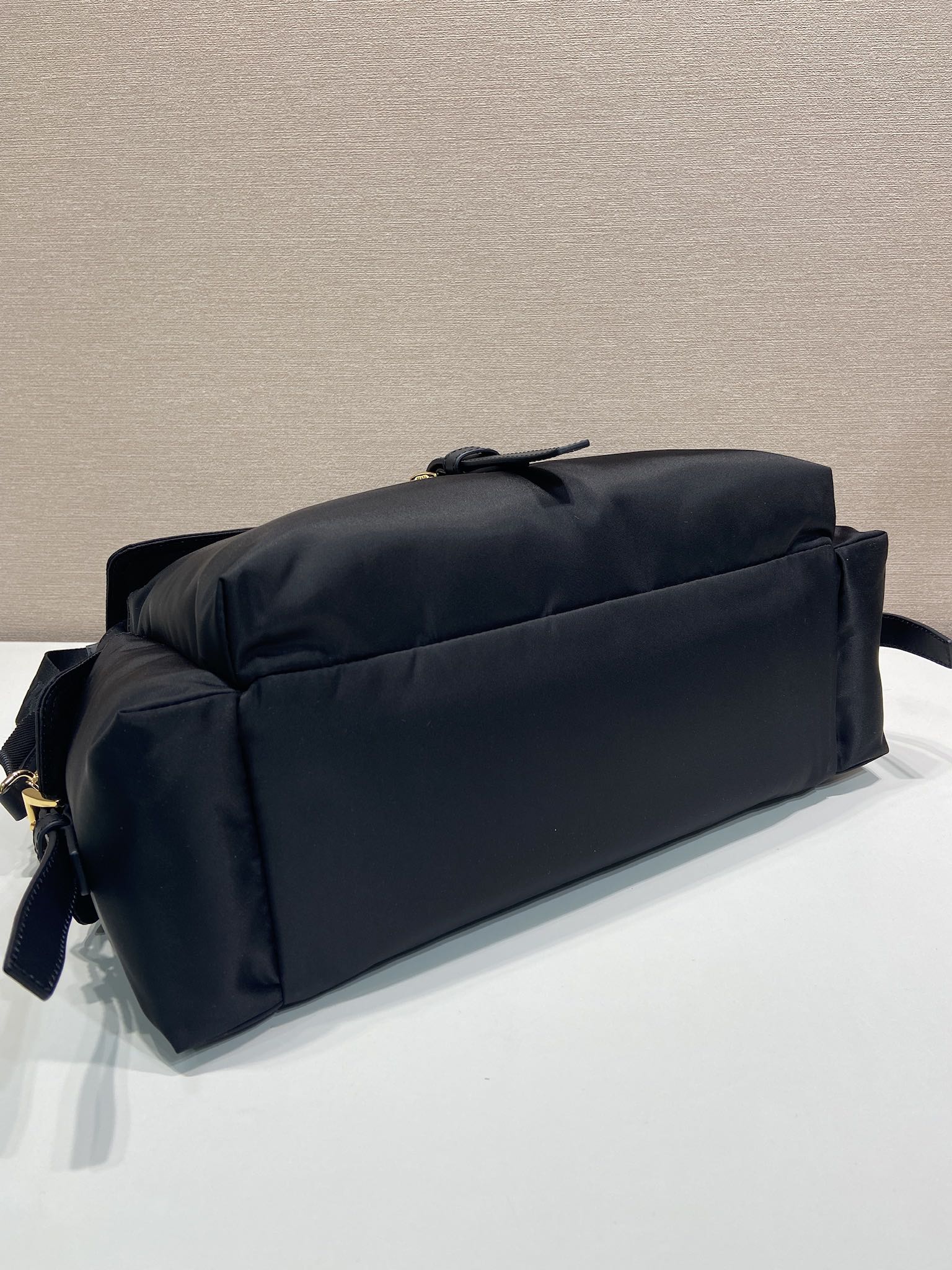 Prada nylon tote bag, dark navy, side view with top zip tab