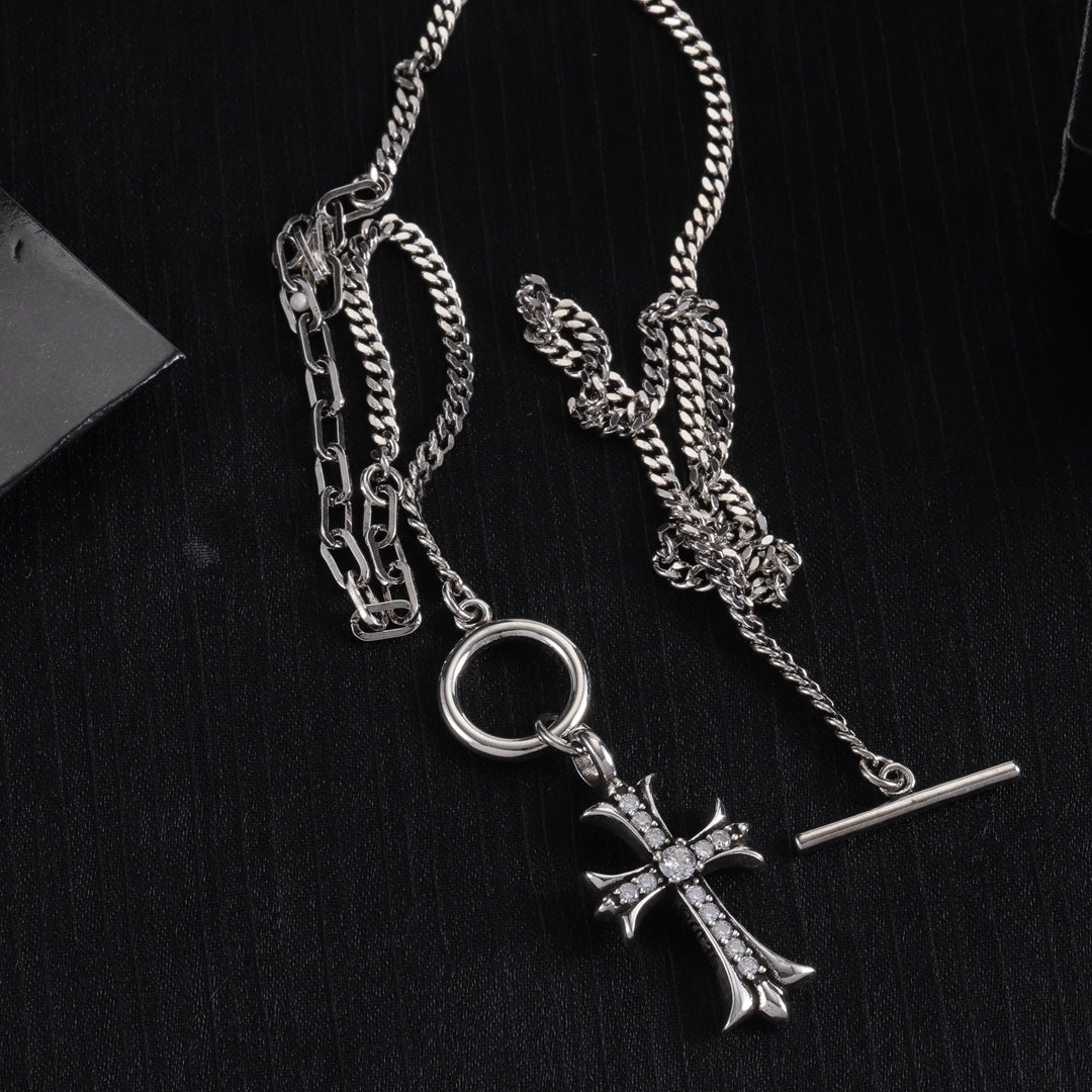 Silver-tone cross pendant necklace with round ring clasp and bar detail