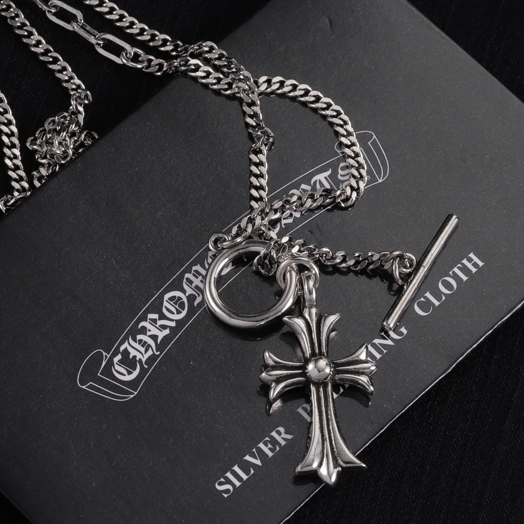 Silver-tone cross pendant necklace with large ring clasp and crystal cross