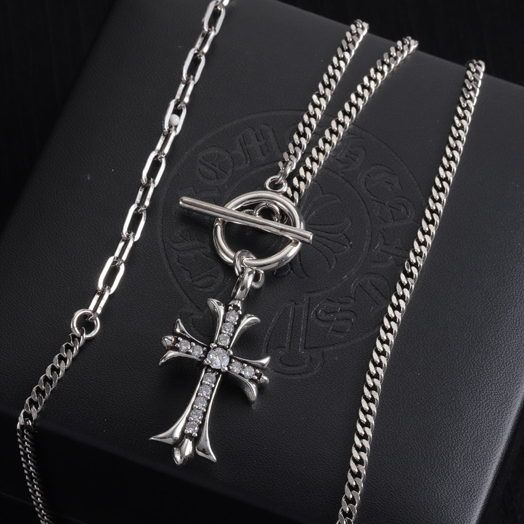 Silver-tone cross pendant necklace with stacked chains and crystal cross