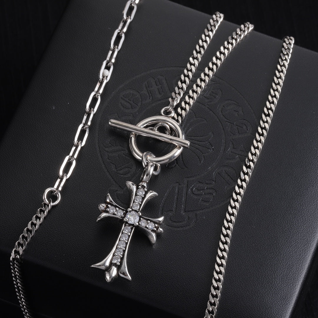 Silver-tone cross pendant necklace with stacked chains and crystal cross