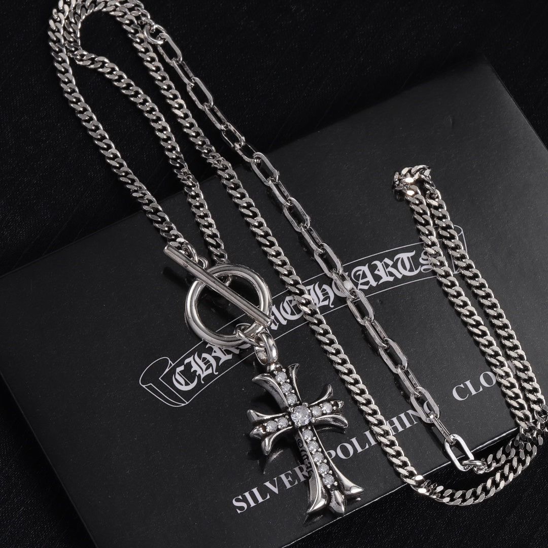 Silver-tone cross pendant necklace with layered curb chains