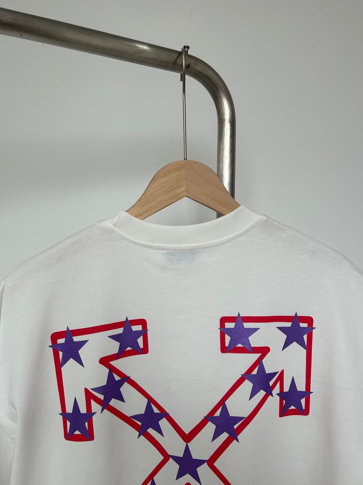 Off-White T-shirt close-up of front graphic with red, white, and blue star shapes