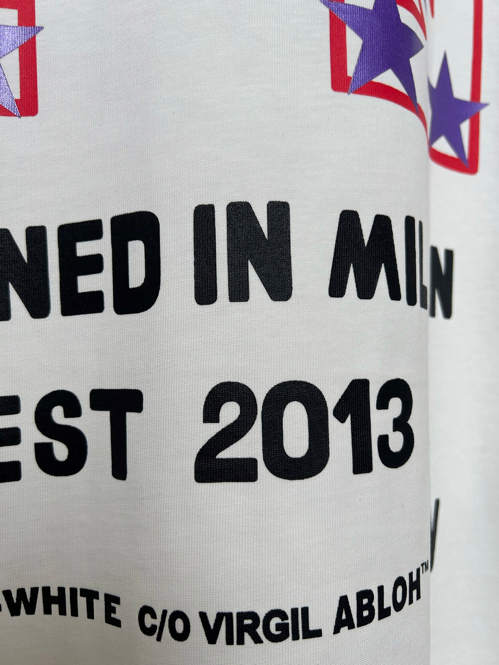 Off-White T-shirt text detail with "DESIGNED IN MILAN" and "EST 2013"