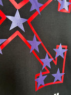 Off-White dark T-shirt close-up of purple stars with red outline graphic.