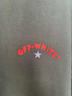 Off-White logo print on dark fabric: red “OFF-WHITE” text with purple star.