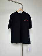 Off-White graphic T-shirt in dark with red logo print on chest.
