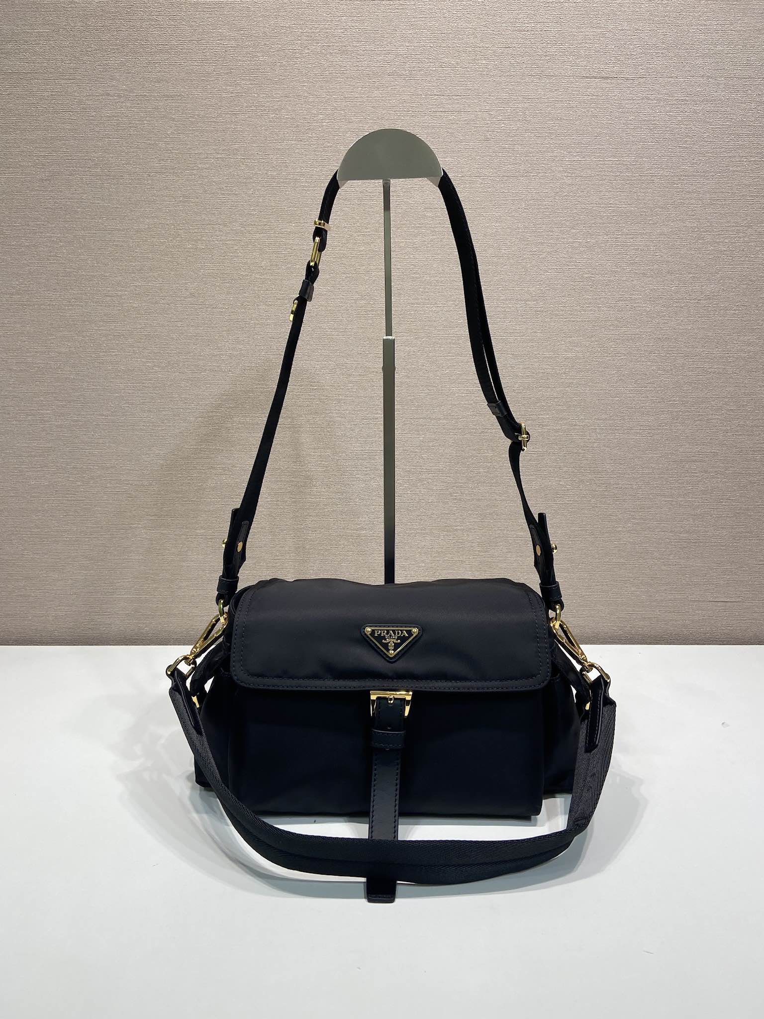 Prada crossbody bag, dark navy, front flap and adjustable shoulder strap