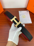 Leather belt with dark textured strap and gold-toned H buckle detail