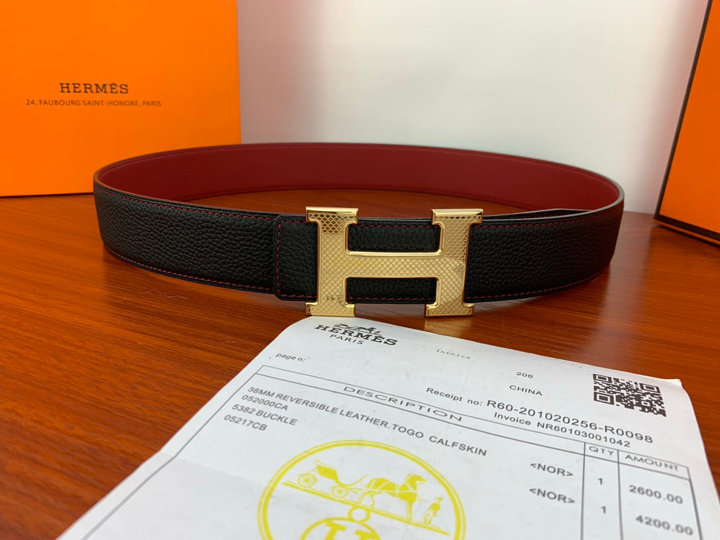 Leather belt with black textured strap and gold-tone H buckle, with red lining