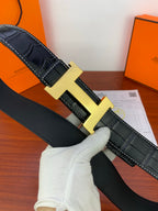 Dark croc-embossed leather belt with silver-tone square buckle detail.