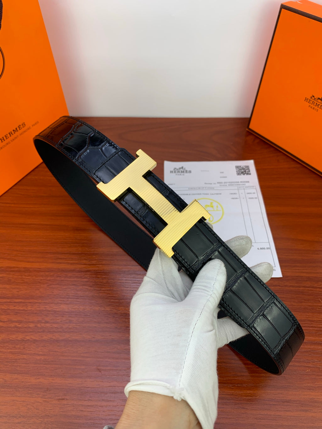 Hermes leather belt in dark blue/black with gold-tone H buckle and textured pattern