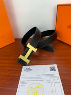 Hermes dark leather belt with gold H buckle and keeper strap