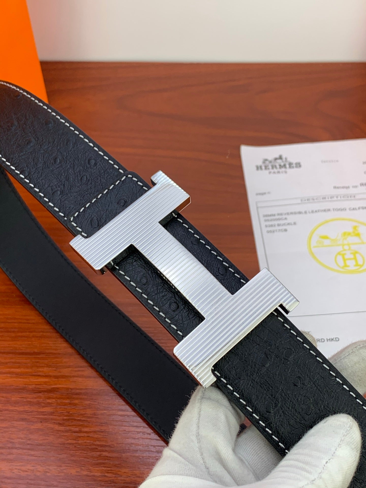 Hermes dark leather belt with silver ribbed H buckle and contrast stitching