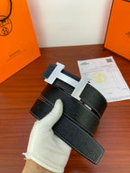 Hermes dark leather belt with wide silver H buckle and contrast stitching