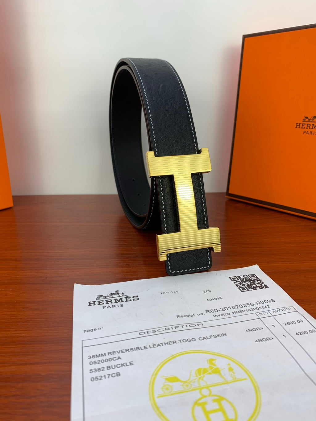 Hermes dark leather belt, gold H buckle detail, contrast stitching