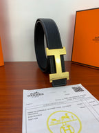 Hermes dark leather belt, gold H buckle detail, contrast stitching