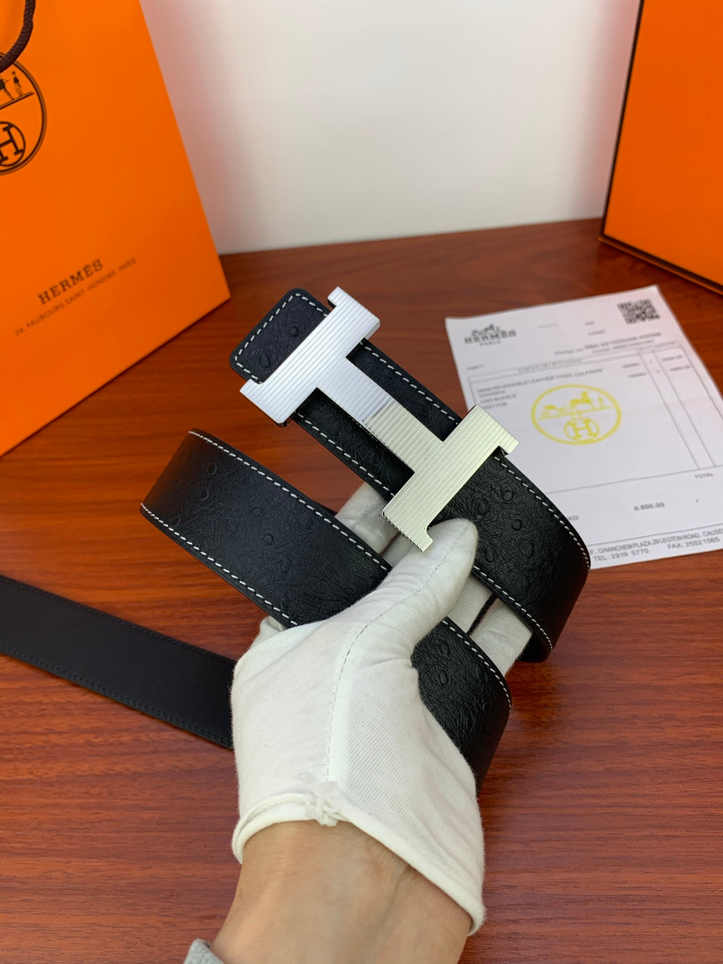 Hermes dark leather belt with silver H buckle and stitched leather strap