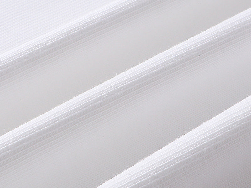 White T-shirt fabric close-up with fine woven texture