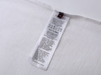 White T-shirt inside size label and care instructions