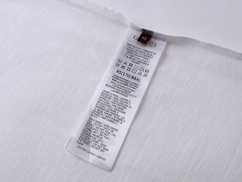 White T-shirt inside size label and care instructions