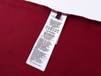 Burgundy Gucci T-shirt care label and size information at inner neck