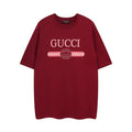 Burgundy Gucci T-shirt with large “GUCCI” graphic and GG emblem at chest