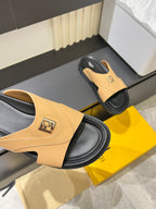 Fendi tan slide sandal showing front strap with Fendi logo plaque