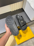 Fendi slide sandals with treaded outsole view and FF logo strap